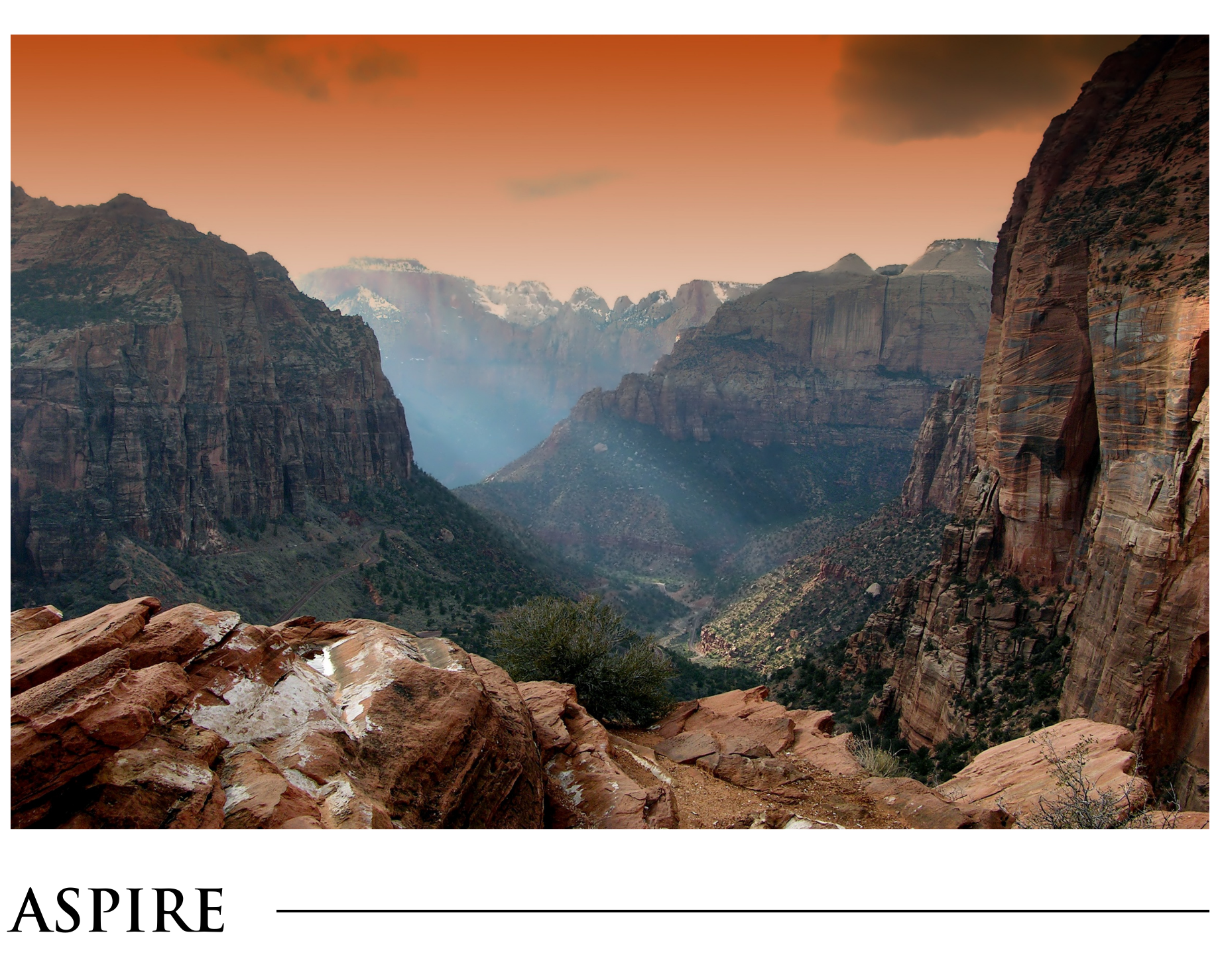 A picture of a canyon with the word aspire on the bottom
