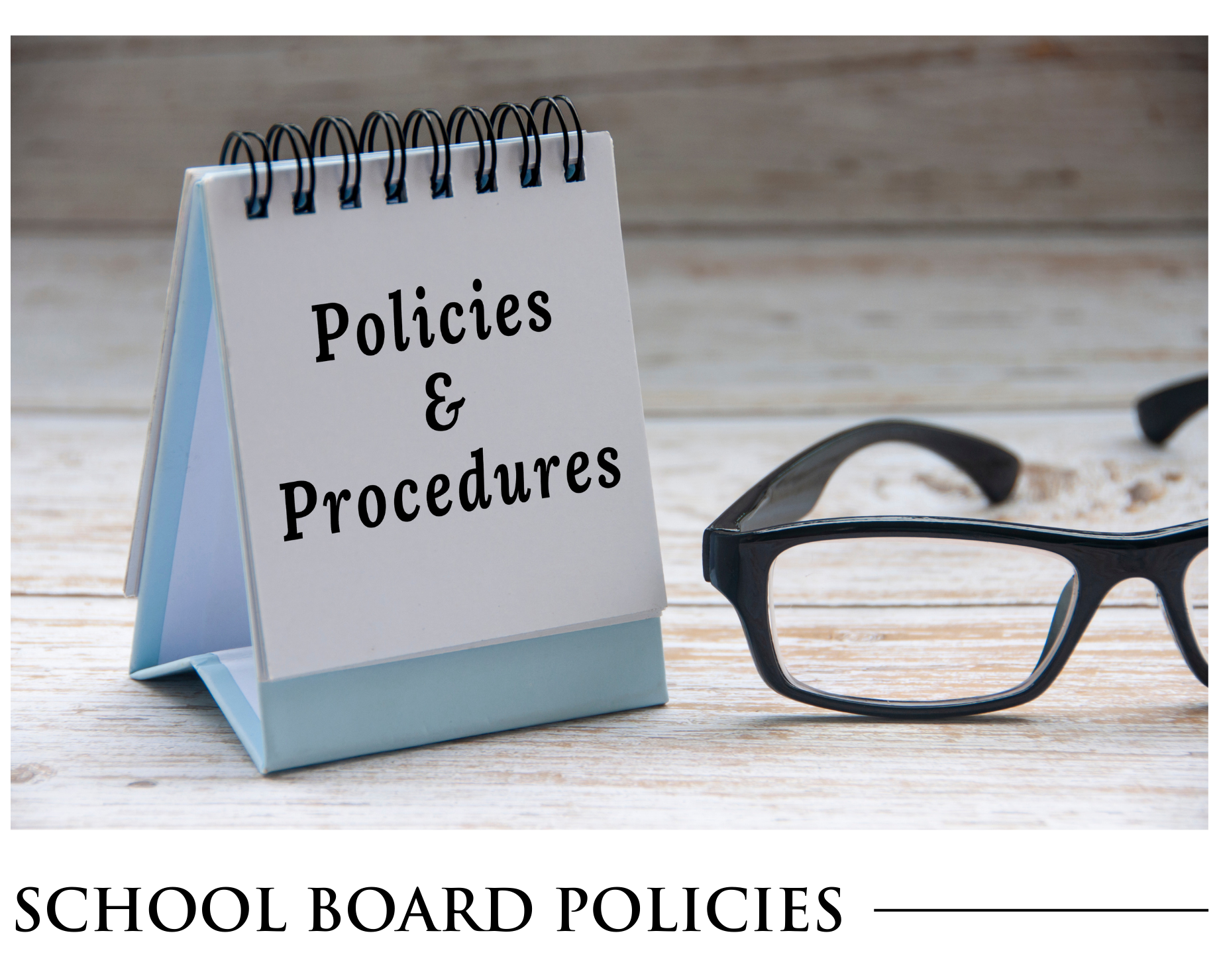 A notepad that says policies and procedures next to a pair of glasses