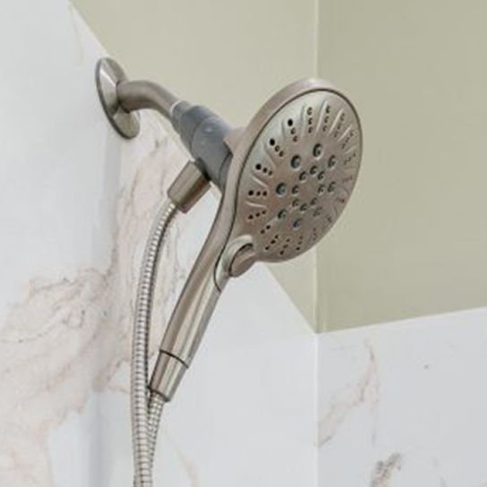 A close up of a shower head with a hose attached to it