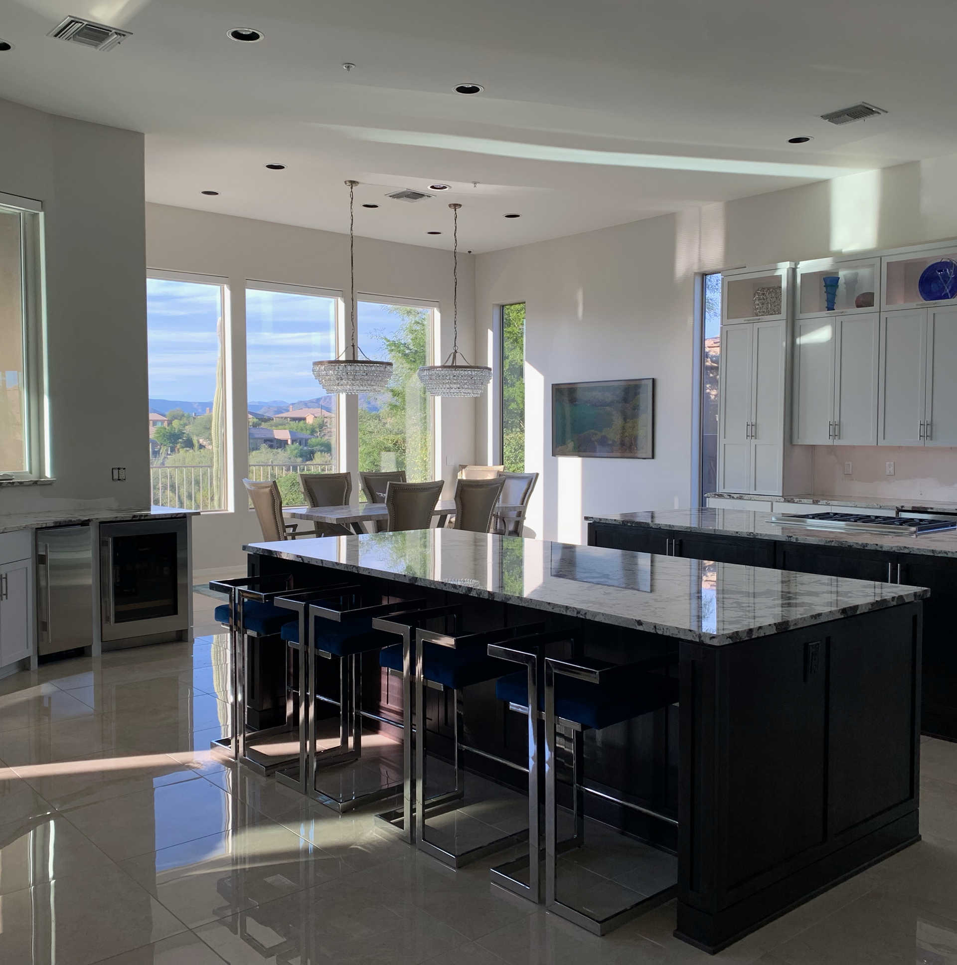 A kitchen with dark cabinets and stainless steel appliances