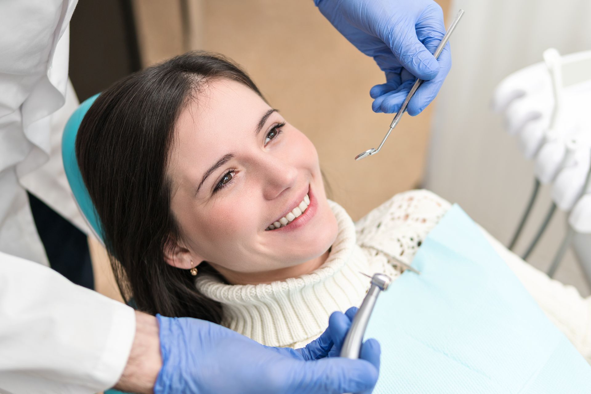 Relaxed woman receiving high-quality dentist services in a modern, comfortable office.