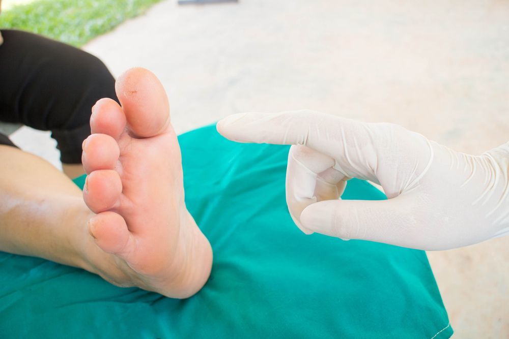 A Close up Of a Person's Foot Being Examined by A Doctor — Betta Foot Clinic in Stretton, QLD