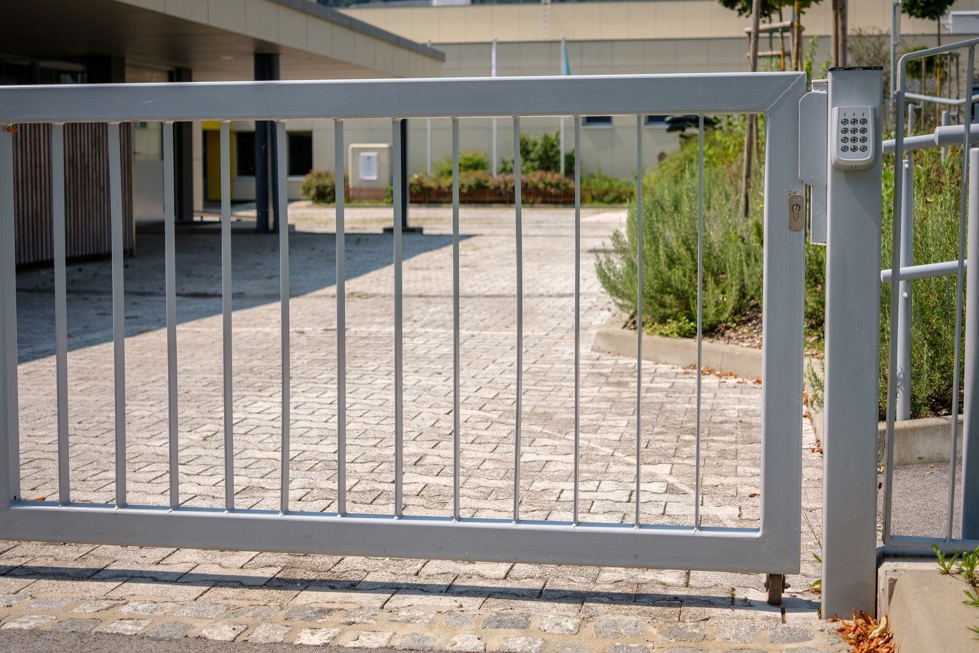 An aluminum gate door on a brick fence in Smithfield, RI by A. Belmonte & Son