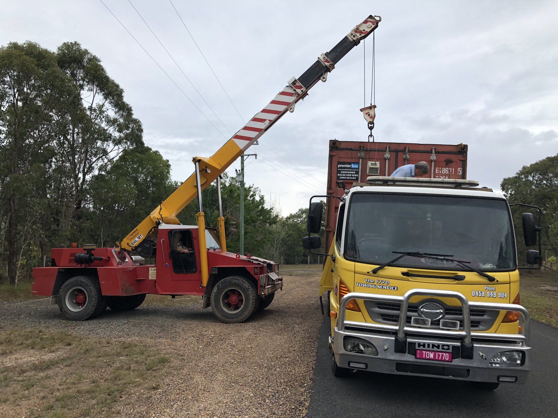 Crane Lifting Red Container - Agnes Water - The 1770 Towing Service