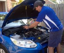 Michael performing car repairs in Bundaberg