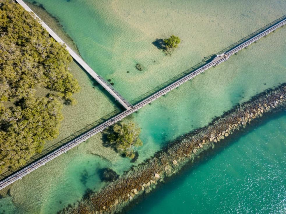 An Aerial View of A Bridge Over a Body of Water — Nick Locke Monuments in Urunga, NSW