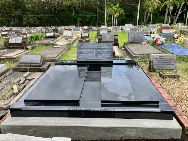 A Bunch of Flowers Are on A Grave in A Cemetery — Nick Locke Monuments in Bellingen, NSW
