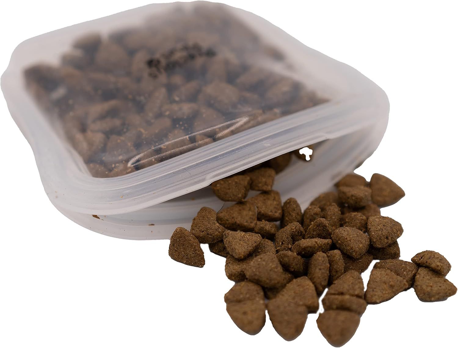 Dry pet food spilling from a clear, opened pouch.