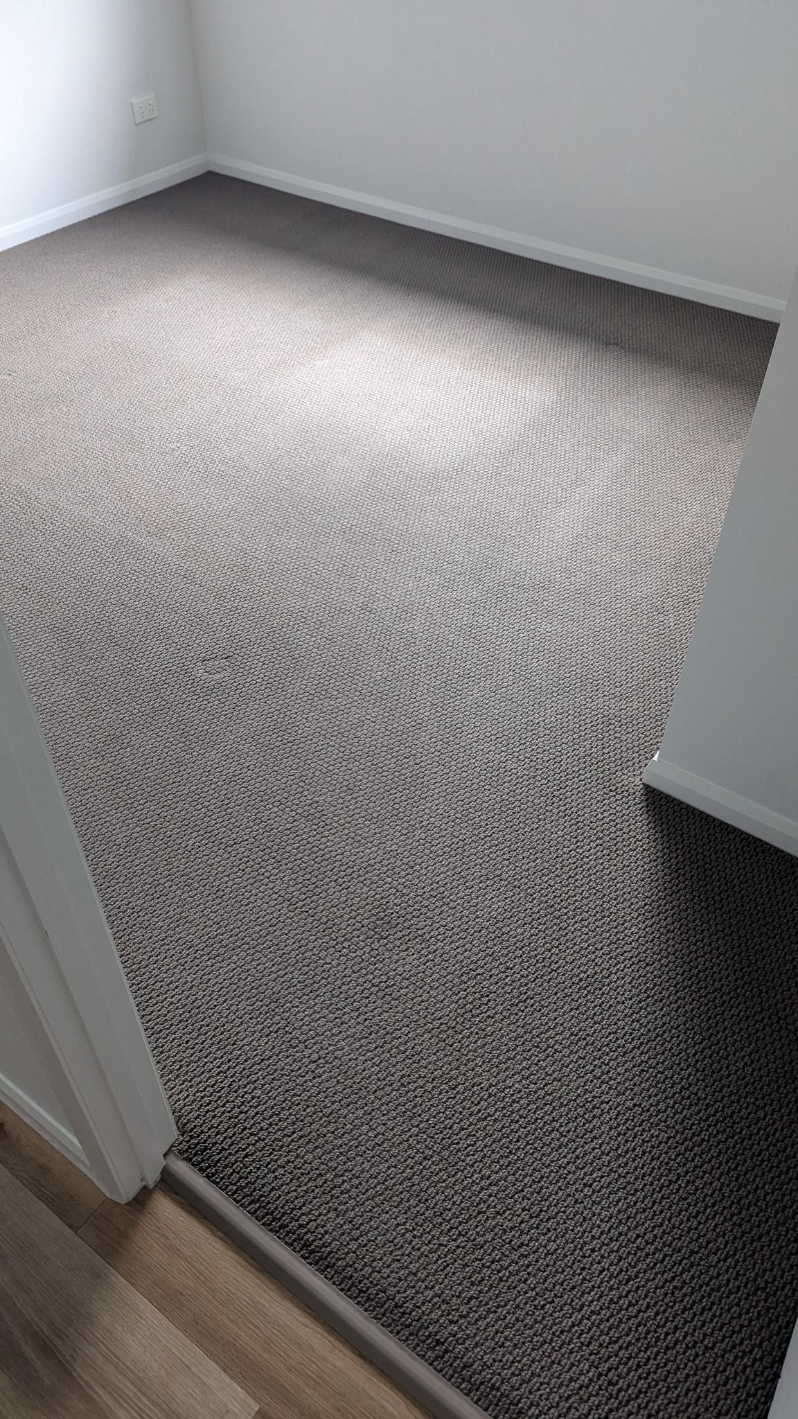 Room with Patterned Carpet in Shades of Gray and White — Total Pest and Carpet Cleaning in Yeppoon, QLD