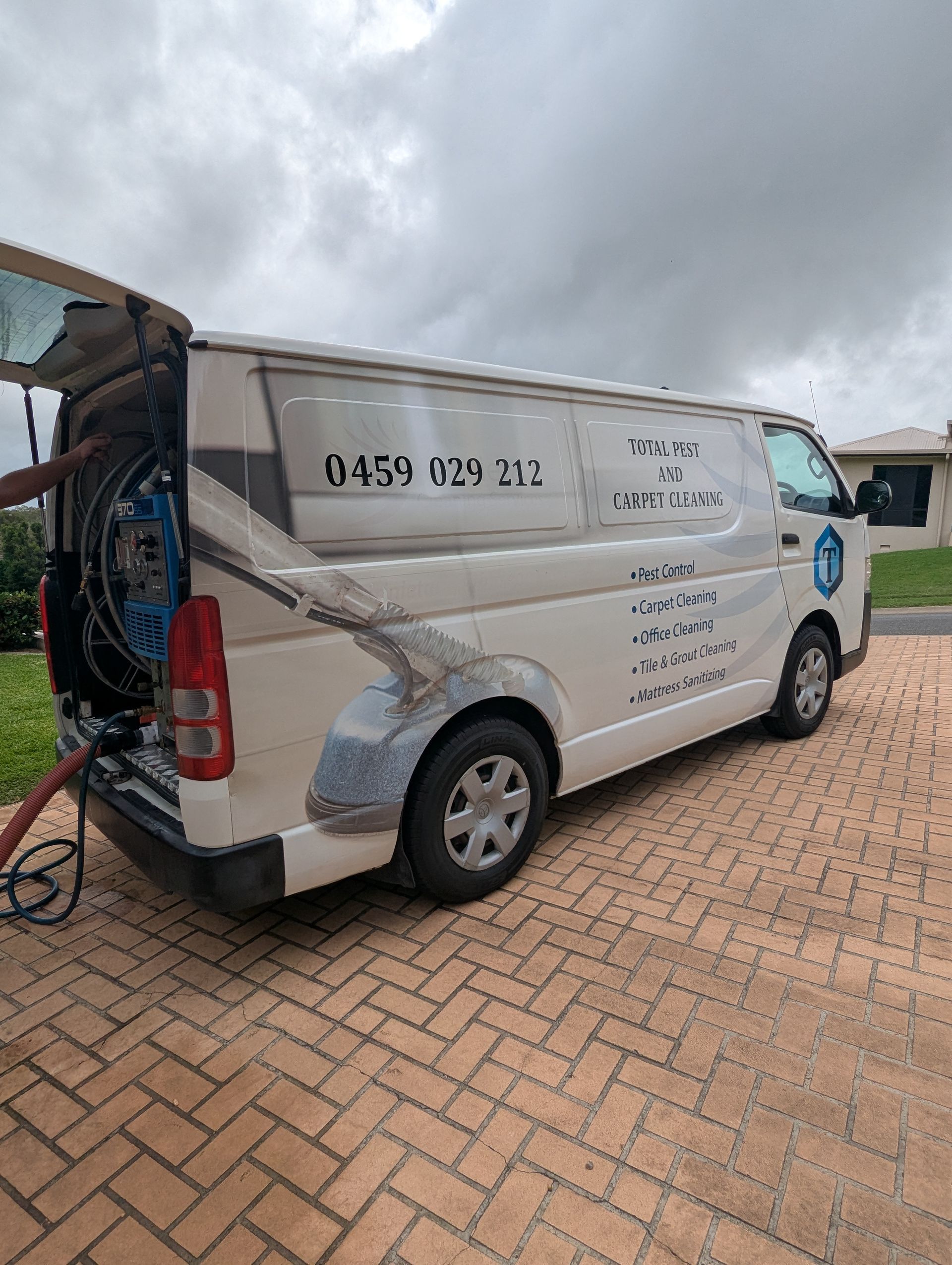 A Man is Spraying Plants in a Garden With a Backpack Sprayer — Total Pest and Carpet Cleaning in Emu Park, QLD