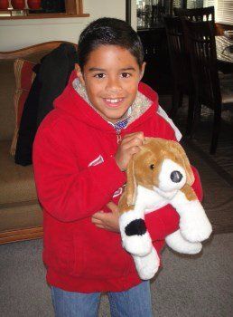 young boy with Beagle toy