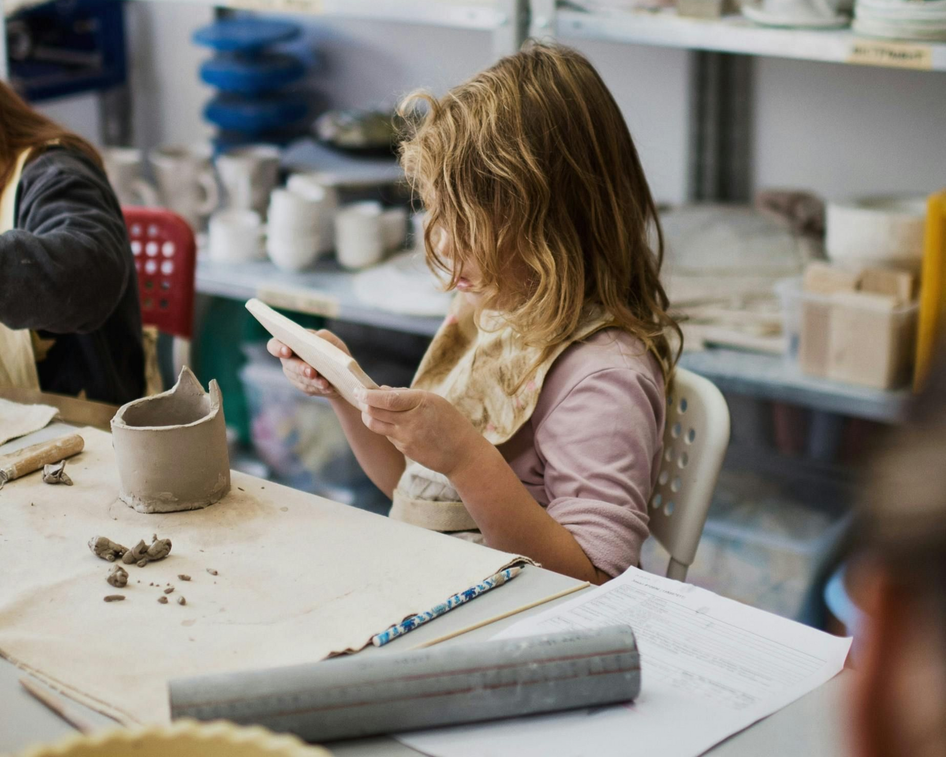 Girl doing fun art activities for Kids Creation Stations' summer camp.