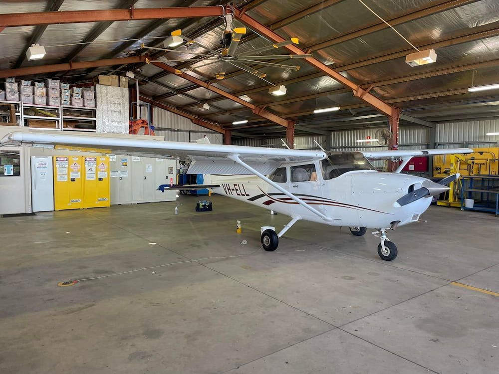 A Small Plane is Parked in a Hangar — TB Detailing in Miles End, QLD