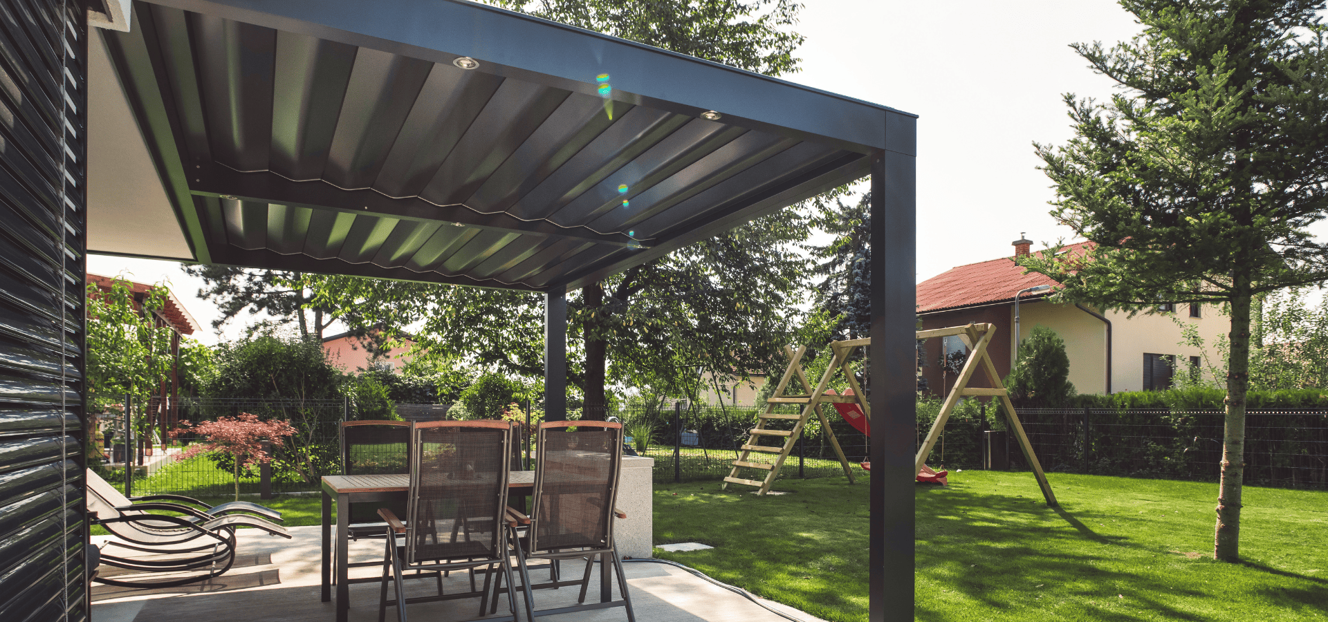 Aluminium composite awning sheltering an outdoor patio in a landed house in Singapore
