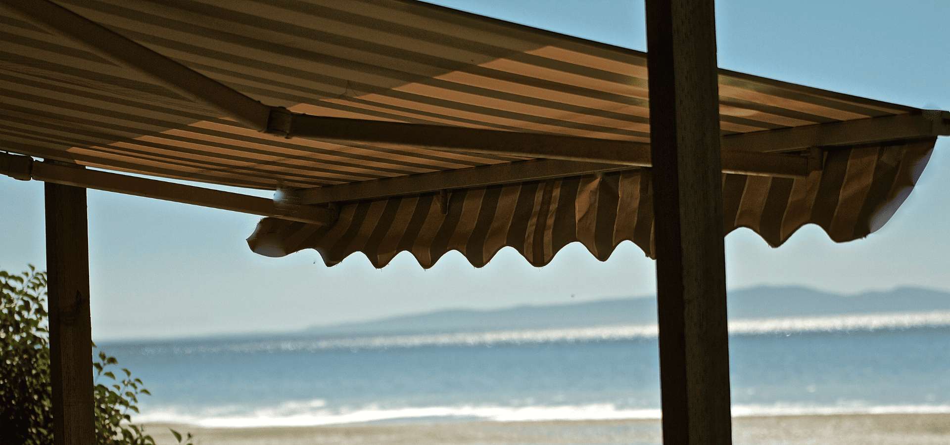 Awning covering a barbecue pit at Sentosa beach in Singapore
