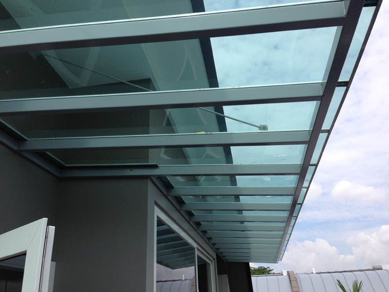 Stationary polycarbonate awning installed by Uni Shades