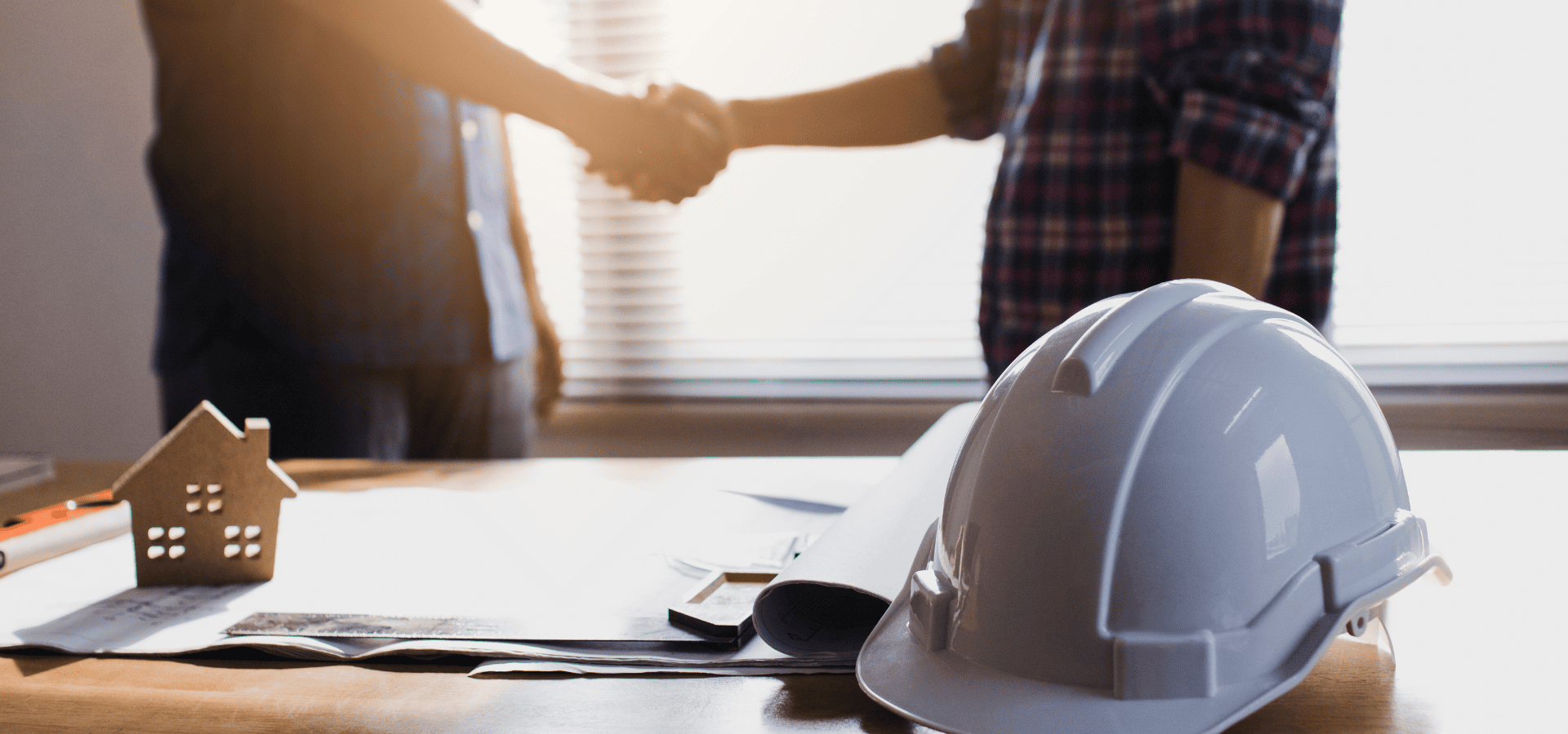 A homeowner in Singapore shaking hands with an awning contractor after coming to an agreement