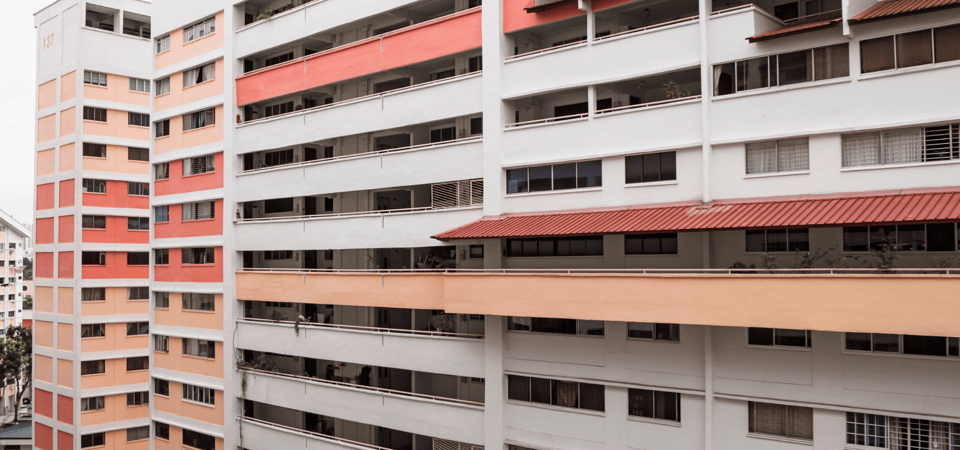 HDB flats in Singapore,painted red, beige, and white