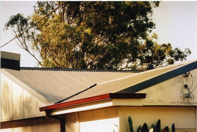 asbestos to metal roof after