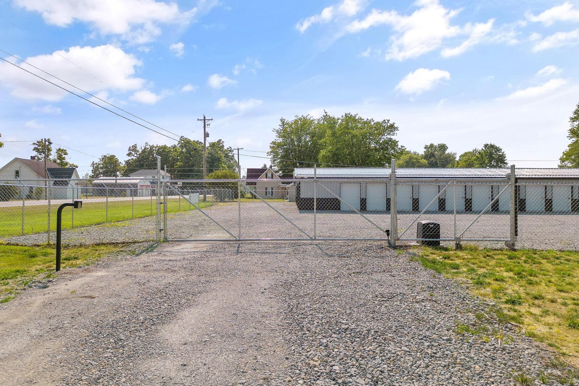 A man is taping a cardboard box with tape.