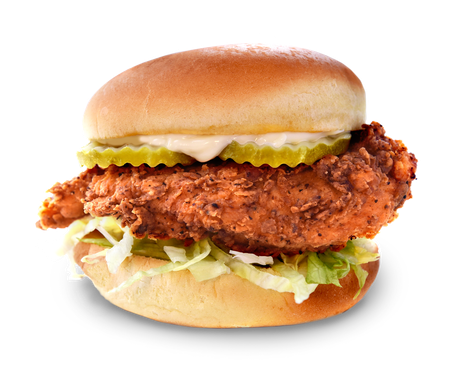 A fried chicken sandwich with lettuce and pickles on a bun