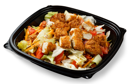 A close up of a salad in a black plastic container
