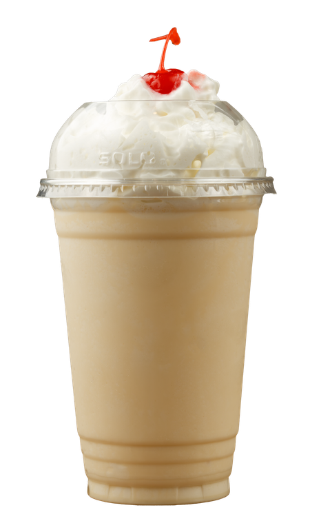 A milkshake with whipped cream and a cherry on top.
