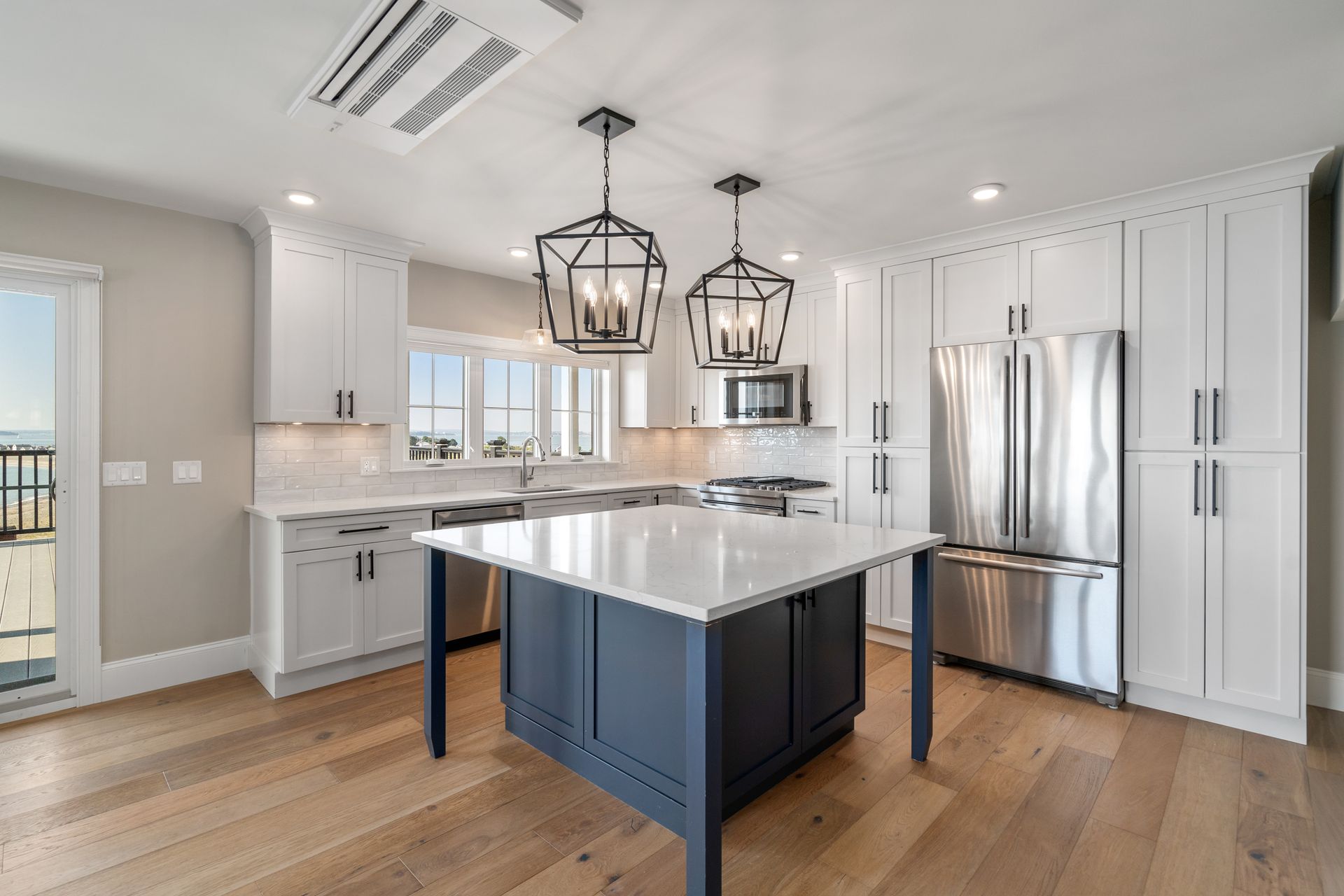 There is a large island in the middle of the kitchen.
