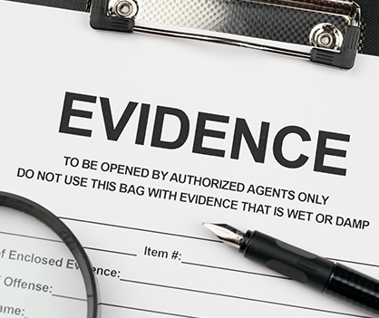 A clipboard with the word evidence on it