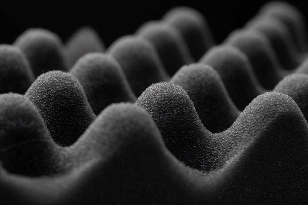 A Close Up of a Black Foam Cushion on a Black Background — F.R.I. Foam & Rubber Industries In Gympie, QLD