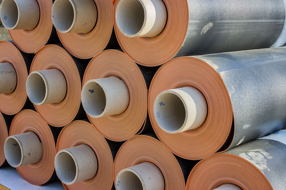 A Bunch of Pipes Are Stacked on Top of Each Other — F.R.I. Foam & Rubber Industries In Gympie, QLD