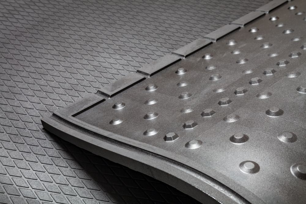 A Close Up of a Black Rubber Mat With Holes in It — F.R.I. Foam & Rubber Industries In Gympie, QLD