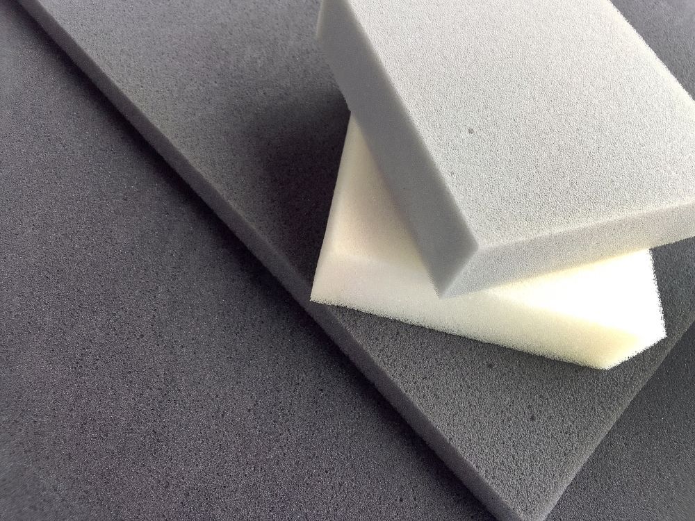 Two Pieces of Foam Are Stacked on Top of Each Other on a Table — F.R.I. Foam & Rubber Industries In Gympie, QLD