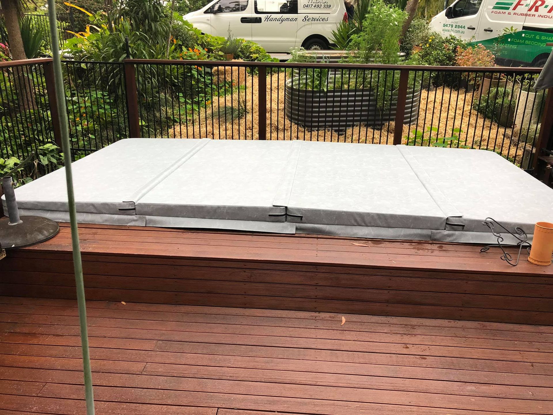A Hot Tub is Sitting on Top of a Wooden Deck — F.R.I. Foam & Rubber Industries In Gympie, QLD