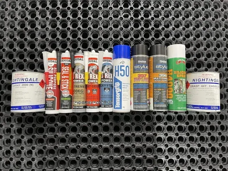 A Bunch of Spray Bottles Are Lined Up on a Mat — F.R.I. Foam & Rubber Industries In Buderim, QLD