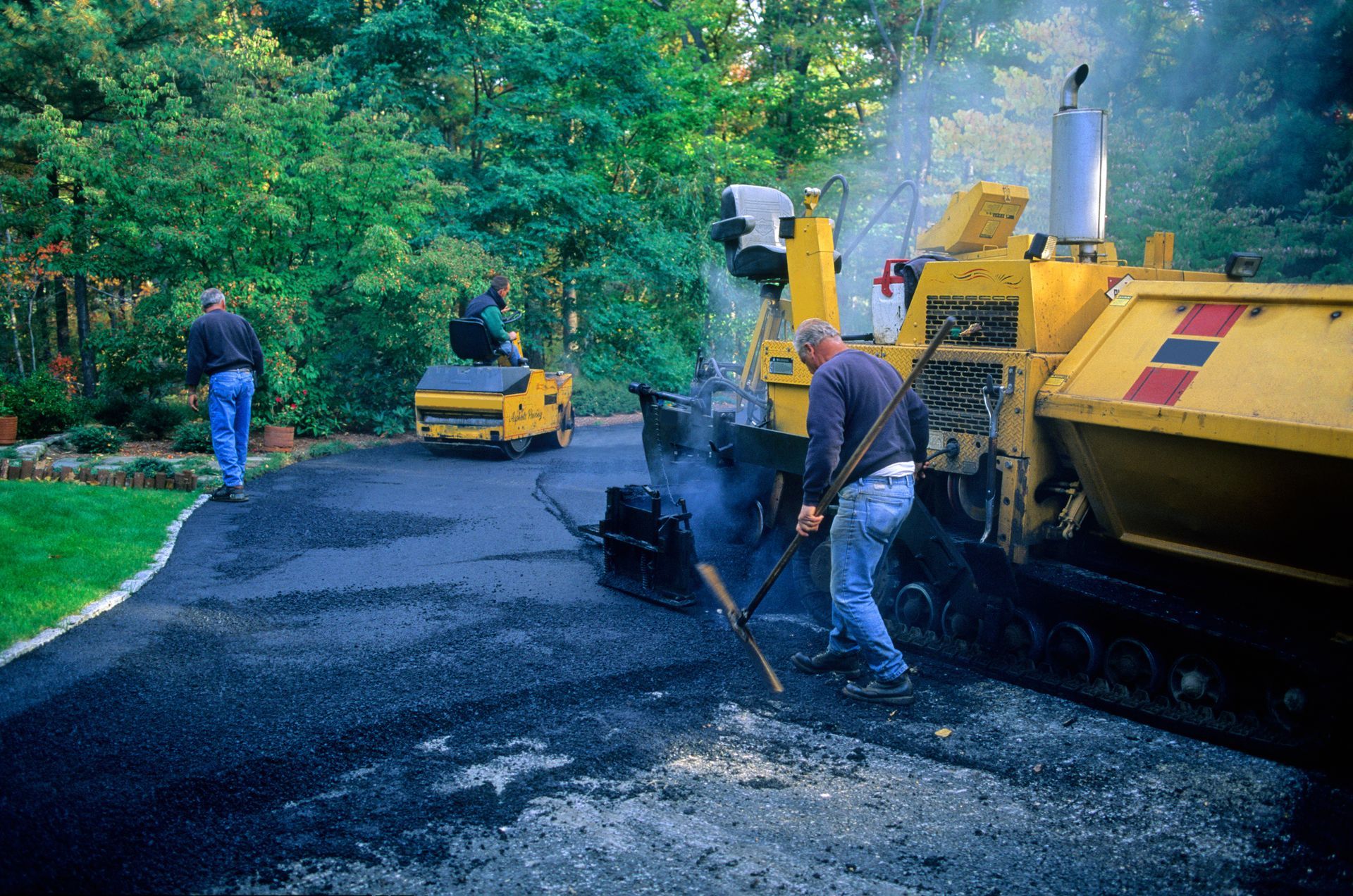 Expert paving crew delivering a smooth, lasting driveway finish with precision and care. Expert paving crew delivering a smooth, lasting driveway finish with precision and care.