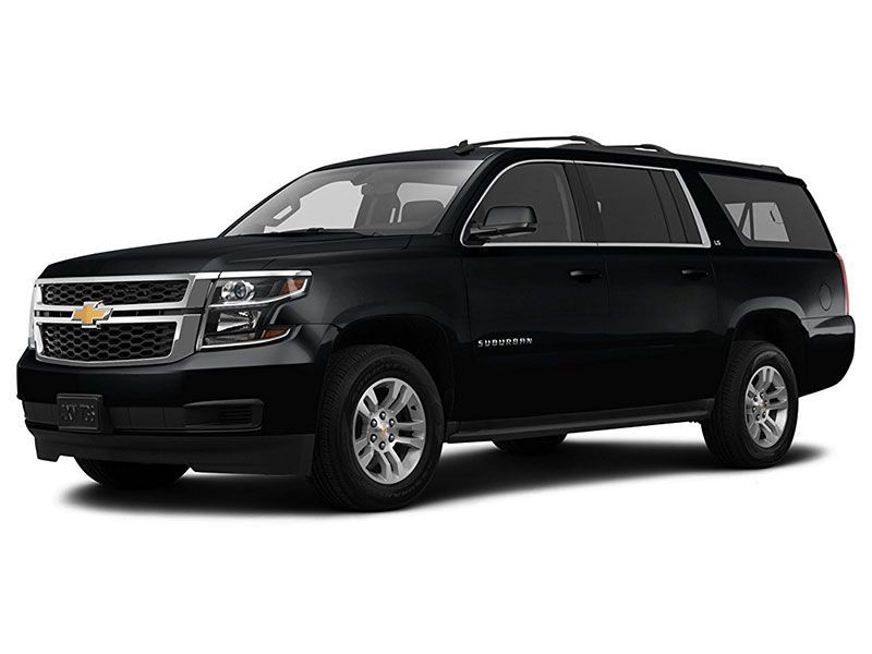 A black Chevrolet Suburban SUV viewed from a front-quarter angle against a white background.