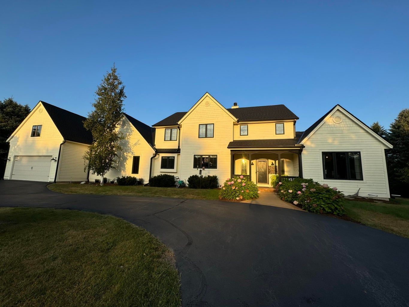 A large white house with a black roof