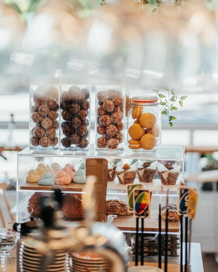 A display case filled with lots of different types of food in a restaurant.