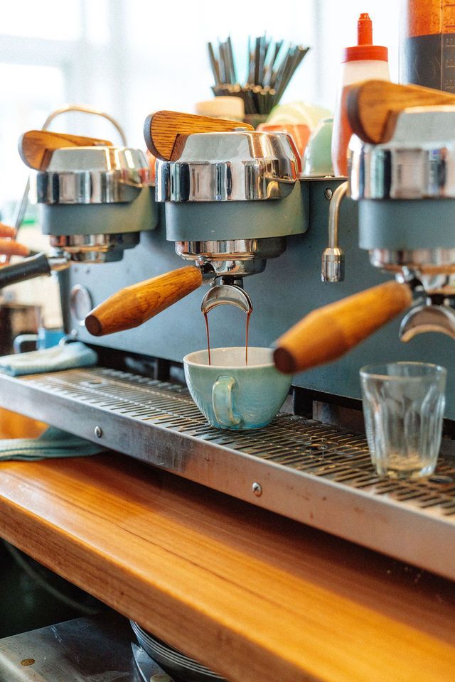A coffee machine is making a cup of coffee.