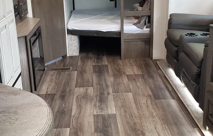 there is a bed in the back of the trailer .