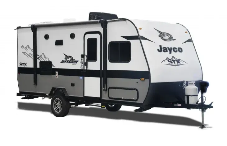 A white and gray jayco trailer is parked on a white background.