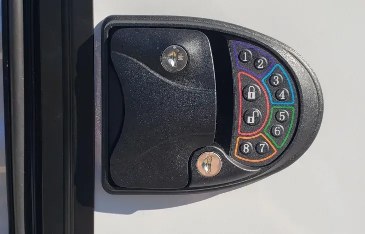 A close up of a keypad on a door.