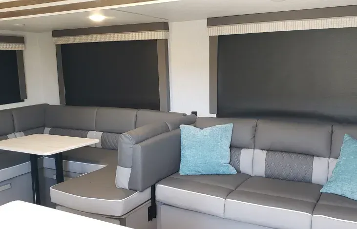 A living room with a couch and a table