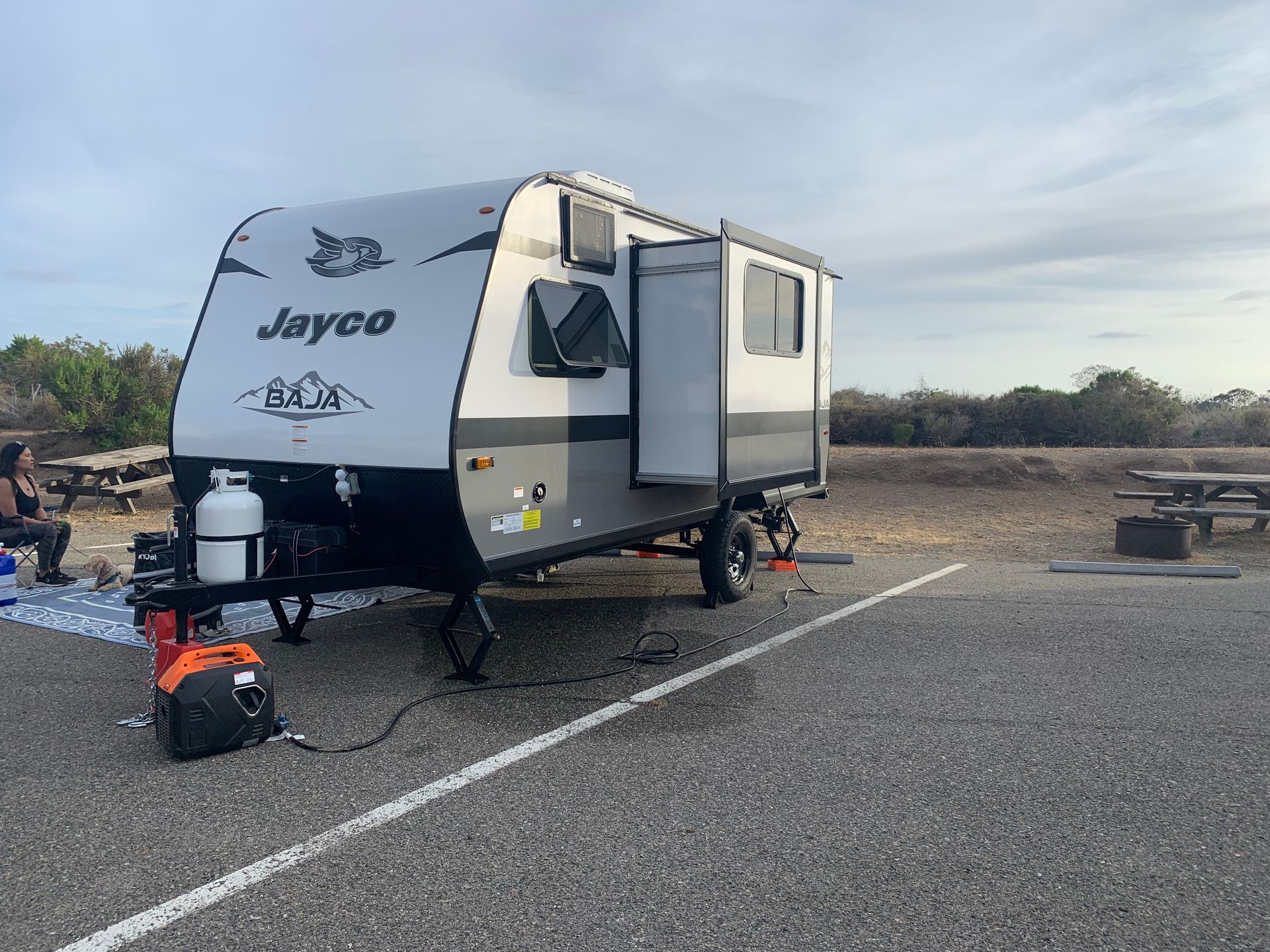 a jayco trailer is parked in a parking lot .