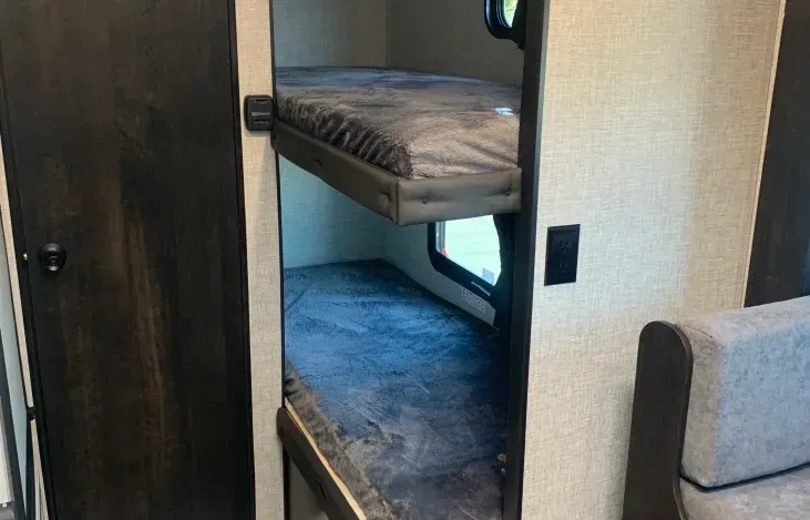 There is a bunk bed in the back of the trailer.