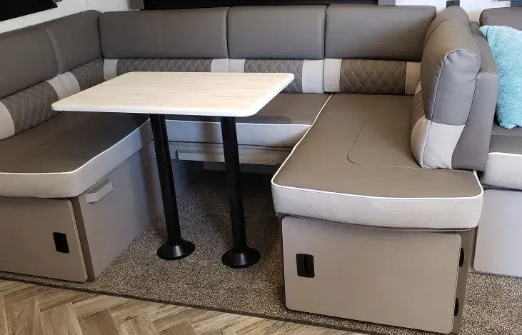 A living room with a couch and a table in it.