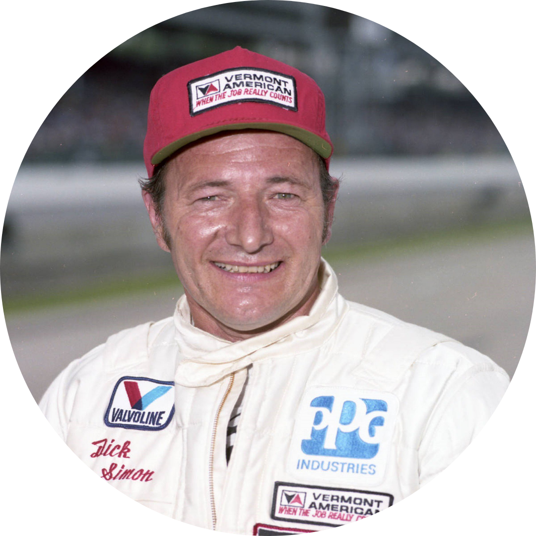 A man wearing a red hat and a white shirt with ppg industries written on it