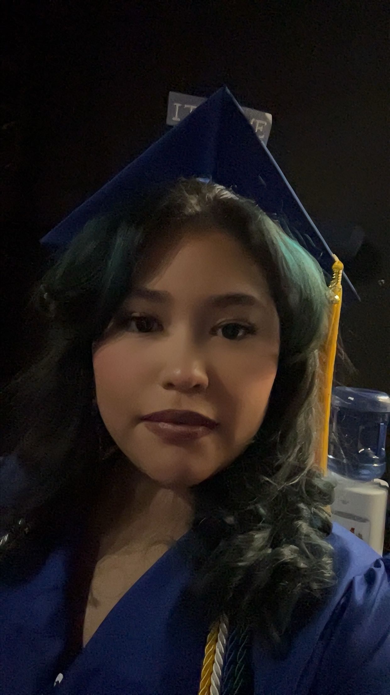 a massage therapist looking into the camera and smiling