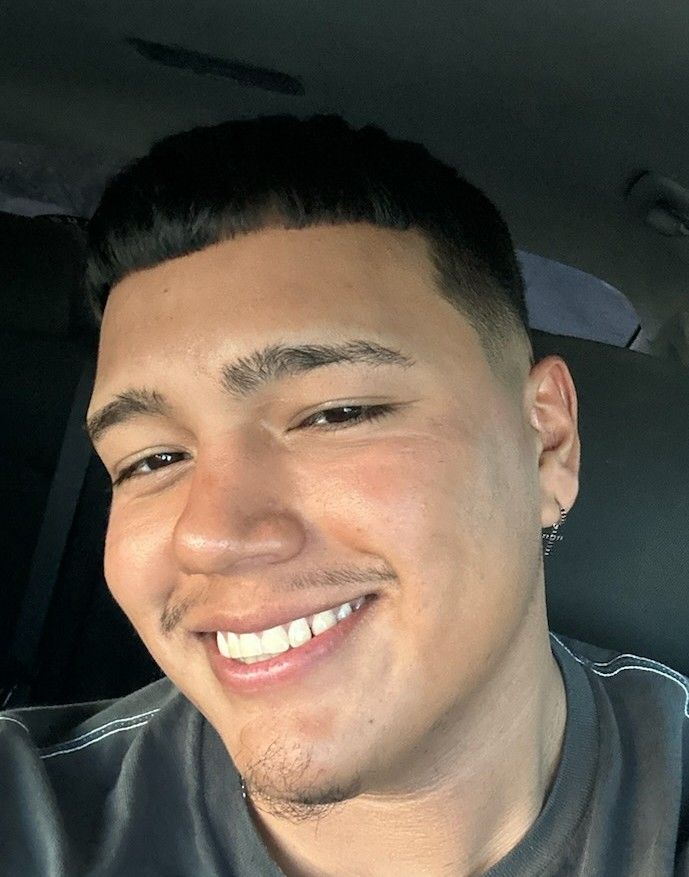 a massage therapist looking into the camera and smiling